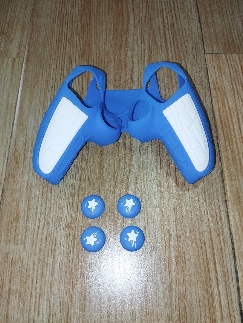 Blue Silicone Controller Cover and Thumb Grips Set (Category: Controllers) located in Pasig City. Submitted by cityshopperph (Listing ID 1470598652, Image 1). Description: - Color: Blue with white textured grip panels - Protection: Soft silicone material shields your controller from scratches and accidental drops - Enhanced Comfort: Textured grip panels improve hold during long gaming sessions - Extras: Includes 4 matching blue thumb grips featur