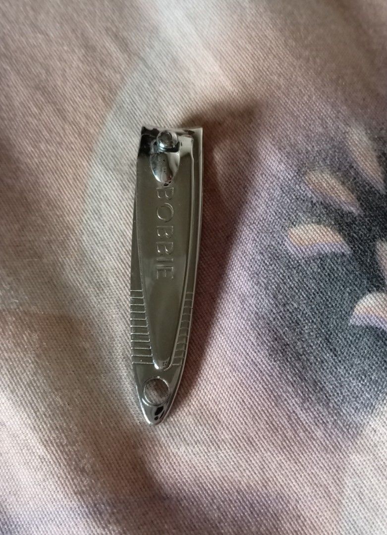 Bobbie Nail Clipper Metal (Category: Hands & Nails) located in Quezon City. Submitted by chacha30.s (Listing ID 1470660186, Image 3). Description: - Genuine Bobbie stainless steel nail clipper - Compact size fits easily in purses or toiletry bags - Textured grip lines near the tip prevent slipping - Smooth standard clipping lever mechanism - Clean and polished metal finish - Brand stamped on front with origin on reverse . Text me at 09277152134 .