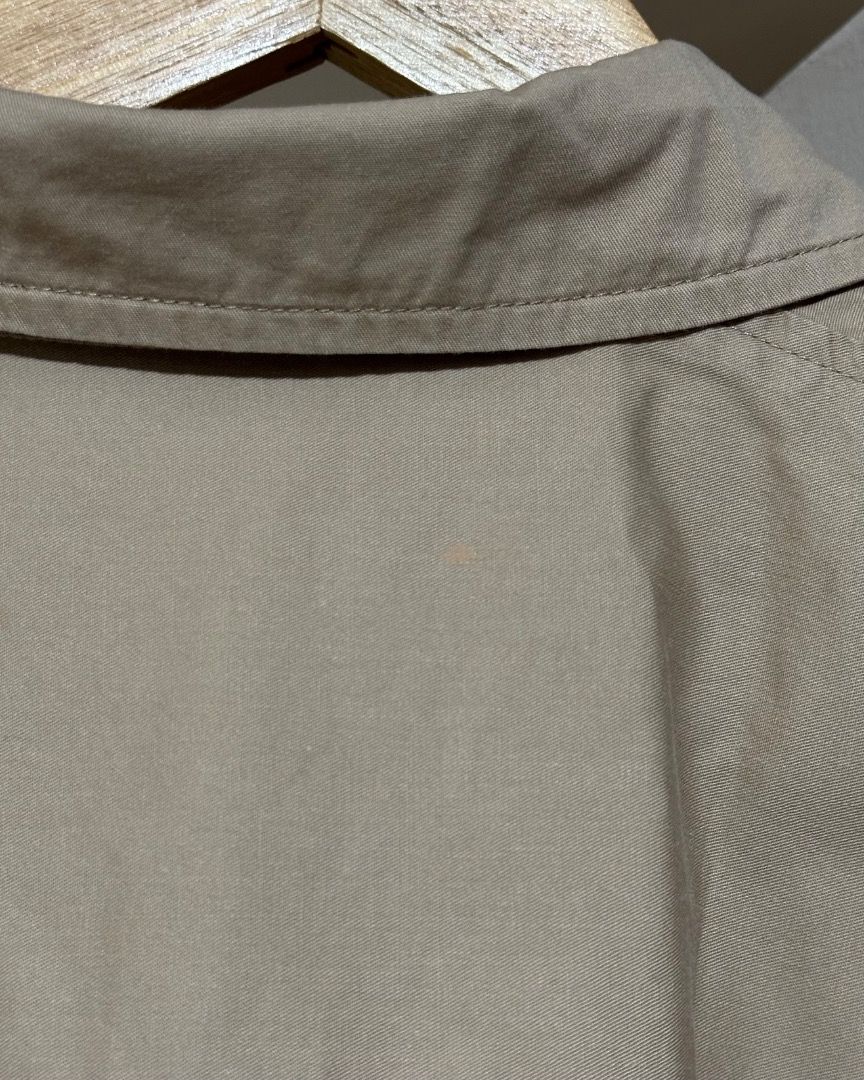 BOCU Tan Button-Down Crop Shirt (Category: Shirts) located in Caloocan City. Submitted by roanneklarisse (Listing ID 1470740982, Image 3). Description: PRELOVED - Brand: BOCU - Size: Small - Color: Versatile tan shade - Style: Short sleeves, boxy crop cut, button-up front, adjustable tie hem - Condition: Good, with a minor faint discoloration mark near the back collar area (please check photos closely) - Location: Calamba.