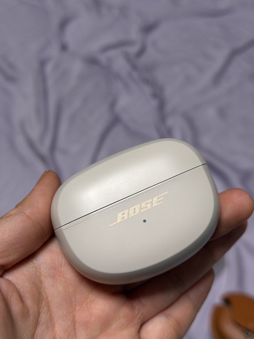 Bose Ultra Open Earbuds (Category: Headphones & Headsets) located in Pasay City. Submitted by chinscollection2021 (Listing ID 1470660379, Image 3). Description: - Model: Bose Ultra Open Earbuds - Color: White Smoke - Condition: Clean, fully tested, and working perfectly with minimal handling marks - Included: Original charging case, USB-C cable, retail box, plus a bonus brown leather protective case with strap pendant - Features: Innovative open-