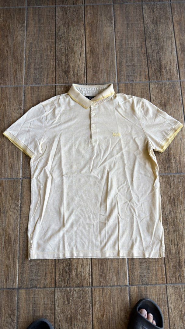 BOSS YELLOW POLO SHIRT (Category: Shirts) located in Manila. Submitted by urban.vintage (Listing ID 1470587727, Image 1). Description: ISSUE: NONE (NEED WASH) MOP :GCASH (NO COD) SHIP VIA: LALAMOVE & J&T LOCATION: PASIG CITY LENGTH: 27 WIDTH : 21.