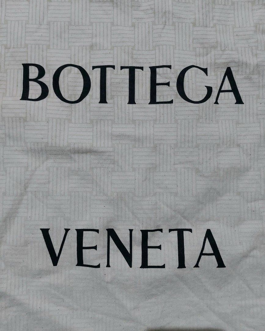 Bottega Veneta Dust Bag Large Drawstring Cotton (Category: Luxury Bags & Wallets) located in Lapu Lapu. Submitted by agnesapm_29813 (Listing ID 1470680575, Image 2). Description: - Authentic Bottega Veneta dust bag - Bold black Bottega Veneta branding on the front - Drawstring closure - Features printed cotton composition and code markings on the bottom edge inside - Measurements: width - 14.5 inches, height-19 inches .