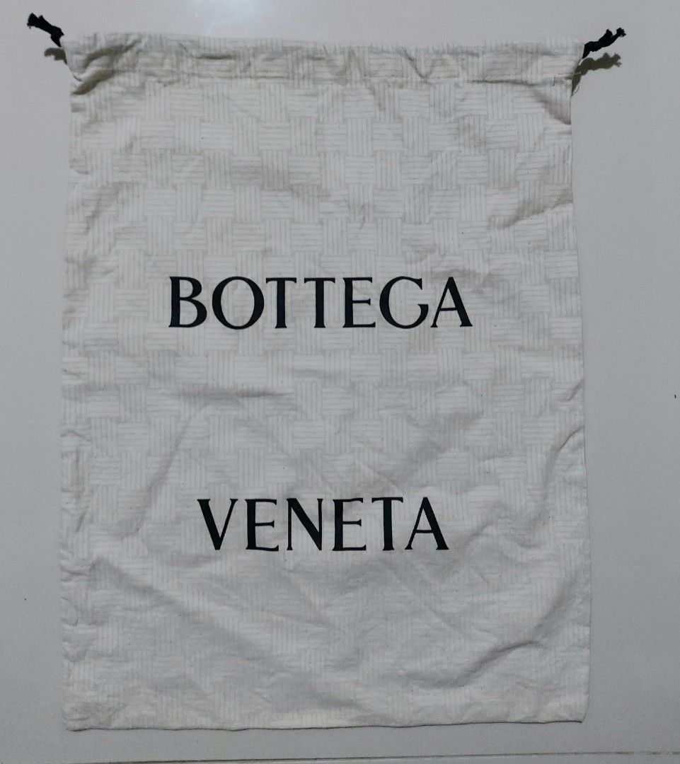 Bottega Veneta Dust Bag Large Drawstring Cotton (Category: Luxury Bags & Wallets) located in Lapu Lapu. Submitted by agnesapm_29813 (Listing ID 1470680575, Image 1). Description: - Authentic Bottega Veneta dust bag - Bold black Bottega Veneta branding on the front - Drawstring closure - Features printed cotton composition and code markings on the bottom edge inside - Measurements: width - 14.5 inches, height-19 inches .