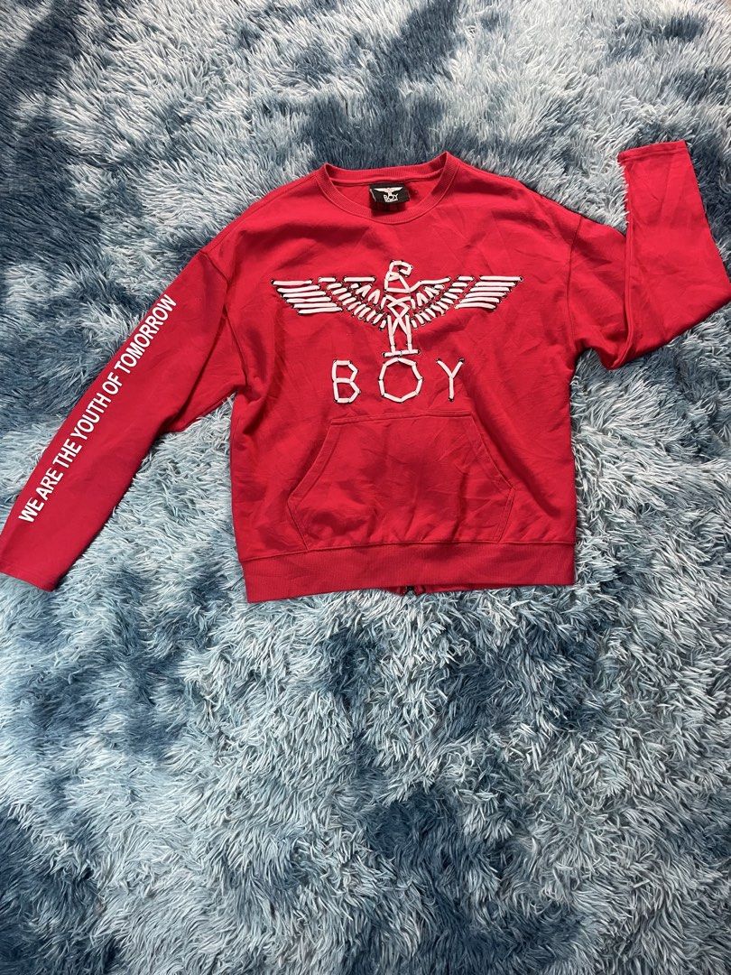 Boy London Red Laced Eagle Sweatshirt (Category: Coats, Jackets and Outerwear) located in Manila. Submitted by jssur (Listing ID 1470684800, Image 1). Description: - Brand: Red Boy London - Design: Iconic eagle graphic made from white laces and eyelets - Details: "WE ARE THE YOUTH OF TOMORROW" text on the right sleeve - Features: Front kangaroo pocket and a full zipper running down the center of the back - Fit: Pit-to-pit measures roughly 21 inch