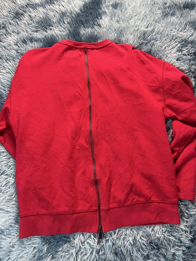 Boy London Red Laced Eagle Sweatshirt (Category: Coats, Jackets and Outerwear) located in Manila. Submitted by jssur (Listing ID 1470684800, Image 3). Description: - Brand: Red Boy London - Design: Iconic eagle graphic made from white laces and eyelets - Details: "WE ARE THE YOUTH OF TOMORROW" text on the right sleeve - Features: Front kangaroo pocket and a full zipper running down the center of the back - Fit: Pit-to-pit measures roughly 21 inch