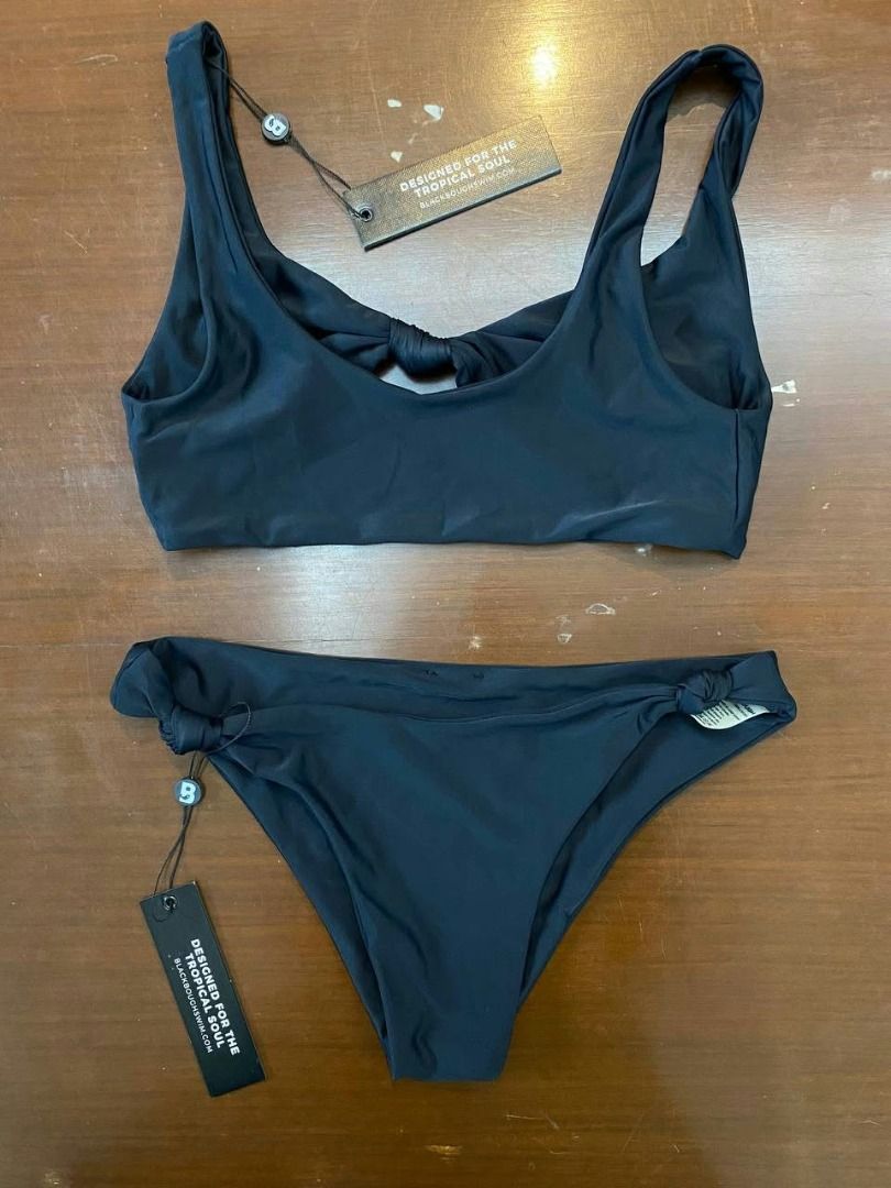 Brand New Blackbough Bikini Top & Bottom Black S (Category: Bikinis & Swimsuits) located in Muntinlupa City. Submitted by irene.aragon.navarro (Listing ID 1470628765, Image 1). Description: Black two-piece bikini set with underwire top and matching bottoms. Adjustable straps on the top. Bottoms feature a high-cut design with metal logo hardware detail. Brand tags still attached, never worn. Great for the beach or pool..