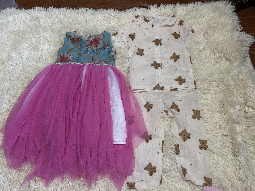 BRANDNEW TAKE ALL 1600 (Category: Babies & Kids Fashion) located in Caloocan City. Submitted by aizabalan52674 (Listing ID 1470599492, Image 2). Description: - Bundle of baby girl clothing (mixed sizes) - Includes 2 pink dresses with flower appliqués, 1 floral tutu dress, and 1 orange polka dot dress with turkey motif - Sleepwear includes 1 bear print pyjama set and 2 watermelon pyjama sets - 5 rompers in mustard yellow and navy blue - Great mix 