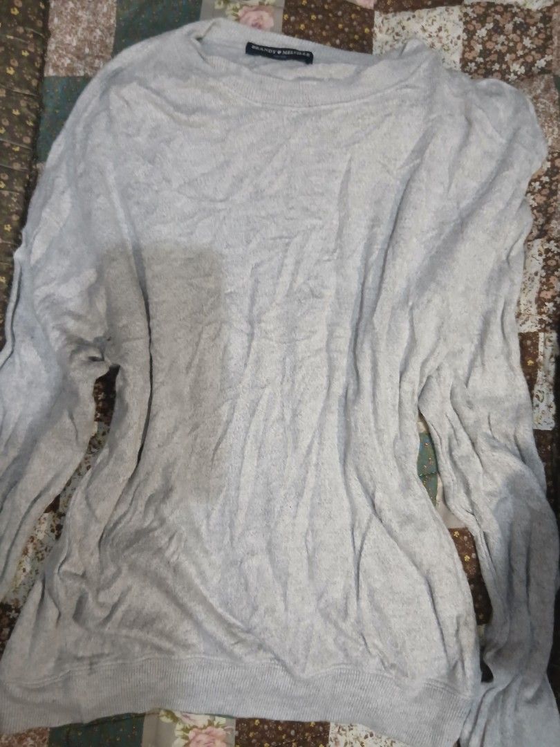 Brandy Melville grey knit sweater one size (Category: Longsleeves) located in Caloocan City. Submitted by emmanmanila (Listing ID 1470638173, Image 2). Description: - Brand: Brandy Melville - Style: Grey knit sweater with classic crew neck and long sleeves - Material: Soft and lightweight - Fit: One size fits all - Details: Ribbed cuffs and hem - Condition: Worn a few times, lots of life left.
