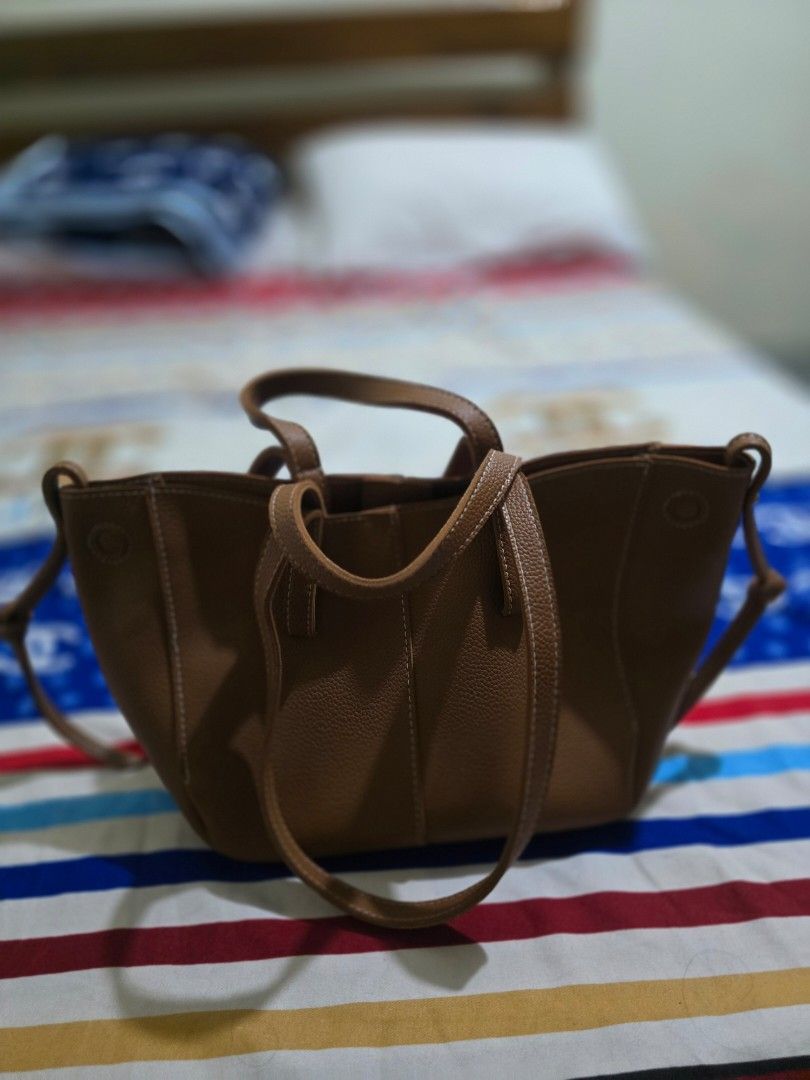 Brown Bag (Category: Shoulder Bags) located in Abucay. Submitted by solaranestbymm (Listing ID 1470606616, Image 3). Description: ITEMS ARE PRELOVED no when worn no rush shipping & requesting of courier shipping fee to be shoulders by buyer rfs: decluttering meetup- tarlac city delivery - j&t.