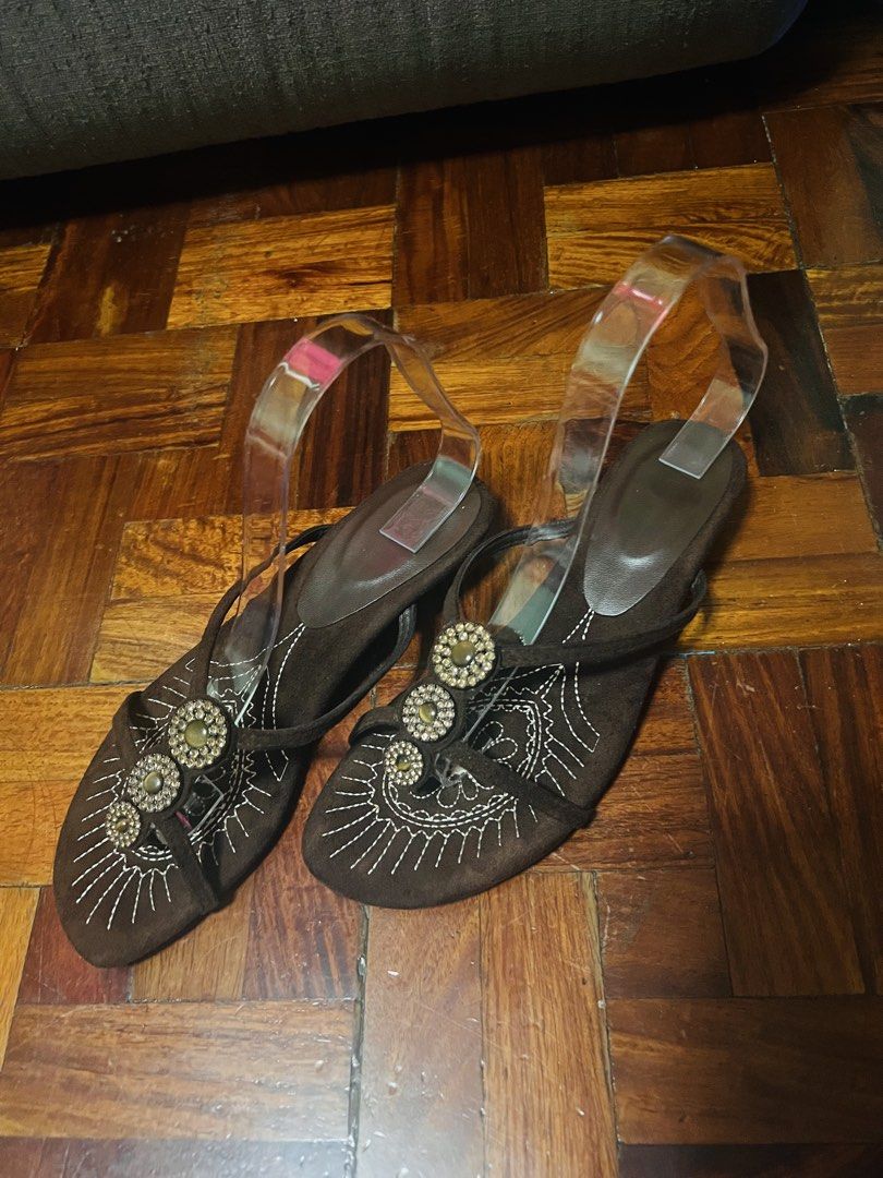 Brown Beaded Embroidered Low Heel Sandals (Category: Flats & Sandals) located in Manila. Submitted by maimaimai.store (Listing ID 1470674771, Image 1). Description: - Brown suede-like material - Decorative white embroidery across the toes - Three circular rhinestone embellishments on the top strap - Comfortable low heel design for easy walking - Convenient slip-on style with thin supportive straps - sandals only, no box.