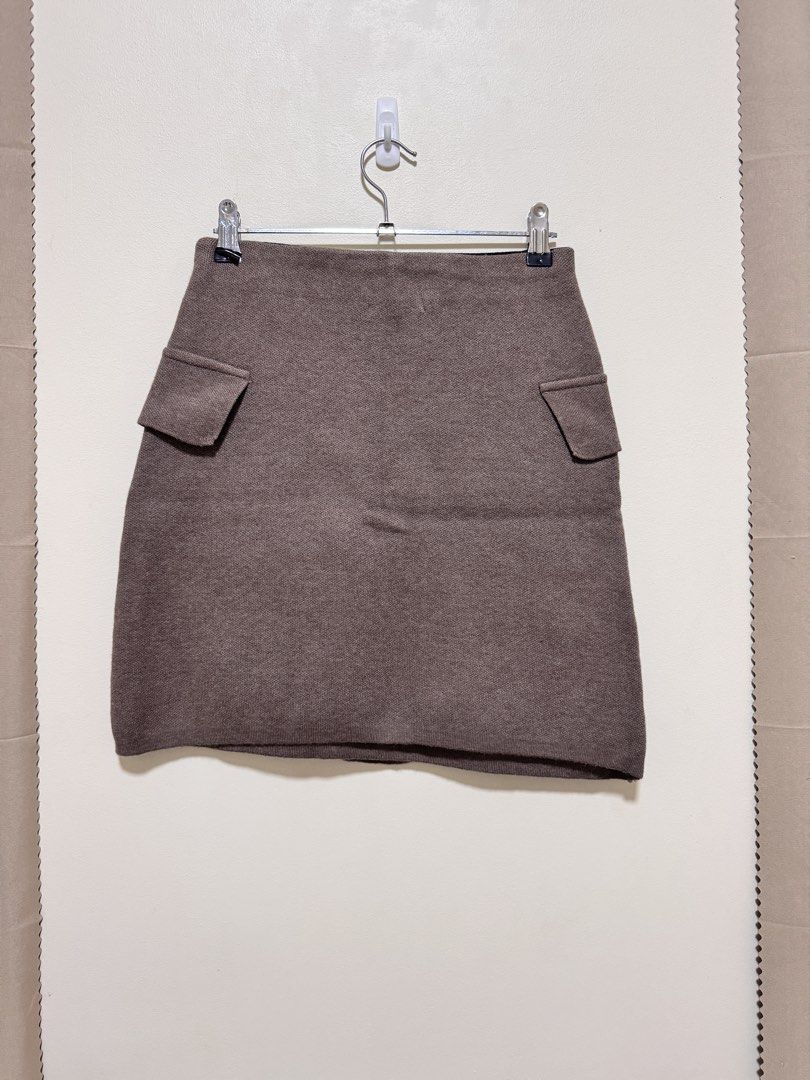 Brown Knit Skirt (Category: Skirts) located in Manila. Submitted by seayouncey (Listing ID 1470715291, Image 2). Description: Size 26 - 30 inches Length 17 inches - Brand: Azara Paris - Color: Brown - Size: TU (Fits most) - Design: Double-breasted look with 4 large textured gold buttons and 2 decorative side pocket flaps - Comfort: Black inner elastic waistband for a flexible, stretch fit - Material: Thick, warm woven textured fabric - Condition: