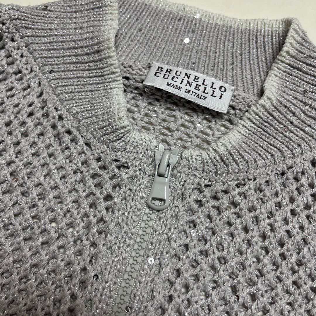 Brunello Cucinelli Metallic Open Knit Bomber Jacket Silver Size S (Category: Coats, Jackets and Outerwear) located in Caloocan City. Submitted by achilles_grails (Listing ID 1470604009, Image 3). Description: - Authentic Brunello Cucinelli zip-up bomber jacket in shimmering silver - Made in Italy with delicate open knit mesh construction - Features ribbed collar, cuffs, and hem - Woven with subtle sparkling sequin accents throughout - Size: Itali