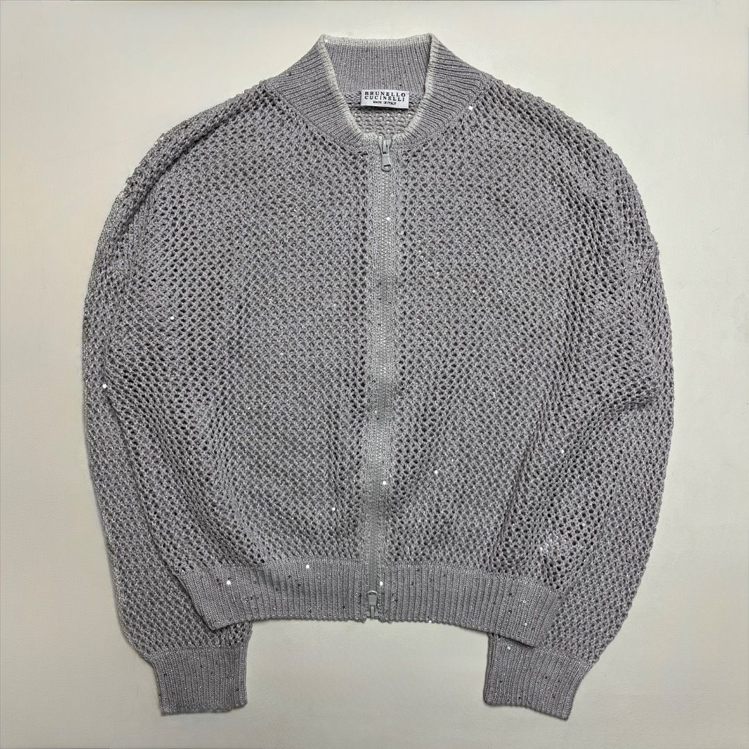Brunello Cucinelli Metallic Open Knit Bomber Jacket Silver Size S (Category: Coats, Jackets and Outerwear) located in Caloocan City. Submitted by achilles_grails (Listing ID 1470604009, Image 1). Description: - Authentic Brunello Cucinelli zip-up bomber jacket in shimmering silver - Made in Italy with delicate open knit mesh construction - Features ribbed collar, cuffs, and hem - Woven with subtle sparkling sequin accents throughout - Size: Itali