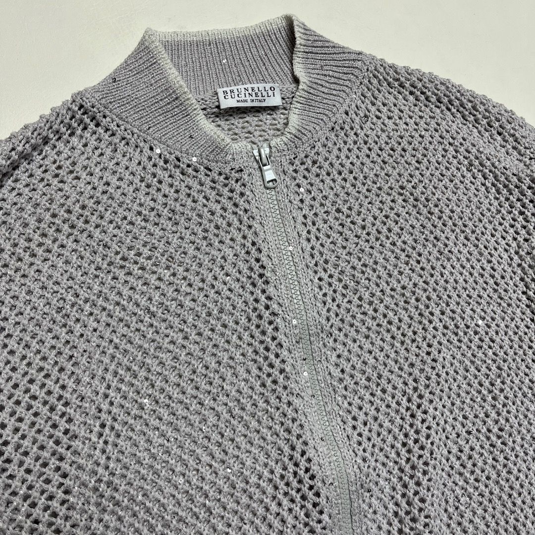 Brunello Cucinelli Metallic Open Knit Bomber Jacket Silver Size S (Category: Coats, Jackets and Outerwear) located in Caloocan City. Submitted by achilles_grails (Listing ID 1470604009, Image 2). Description: - Authentic Brunello Cucinelli zip-up bomber jacket in shimmering silver - Made in Italy with delicate open knit mesh construction - Features ribbed collar, cuffs, and hem - Woven with subtle sparkling sequin accents throughout - Size: Itali