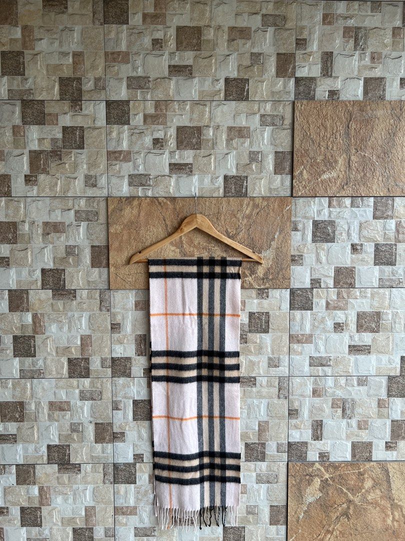 BURBERRY - PLAID DESIGN CASHMERE SCARF (Category: Scarves) located in Bacolod City. Submitted by timelessbyjosh (Listing ID 1470694109, Image 1). Description: BEST FOR COZY OUTFITS SIZE : ACTUAL COLOR : BLACK , BEIGE , BROWN & ORANGE COLOR RATE : 10 OUT OF 10 CONDITION : EXCELLENT MATERIAL : 100 % CASHMERE MADE IN : SCOTLAND FLAWS : NONE DIMENSIONS LENGTH - 65 WIDTH - 11. 5 MEASUREMENT TAKEN WHILE LAYING FLAT..