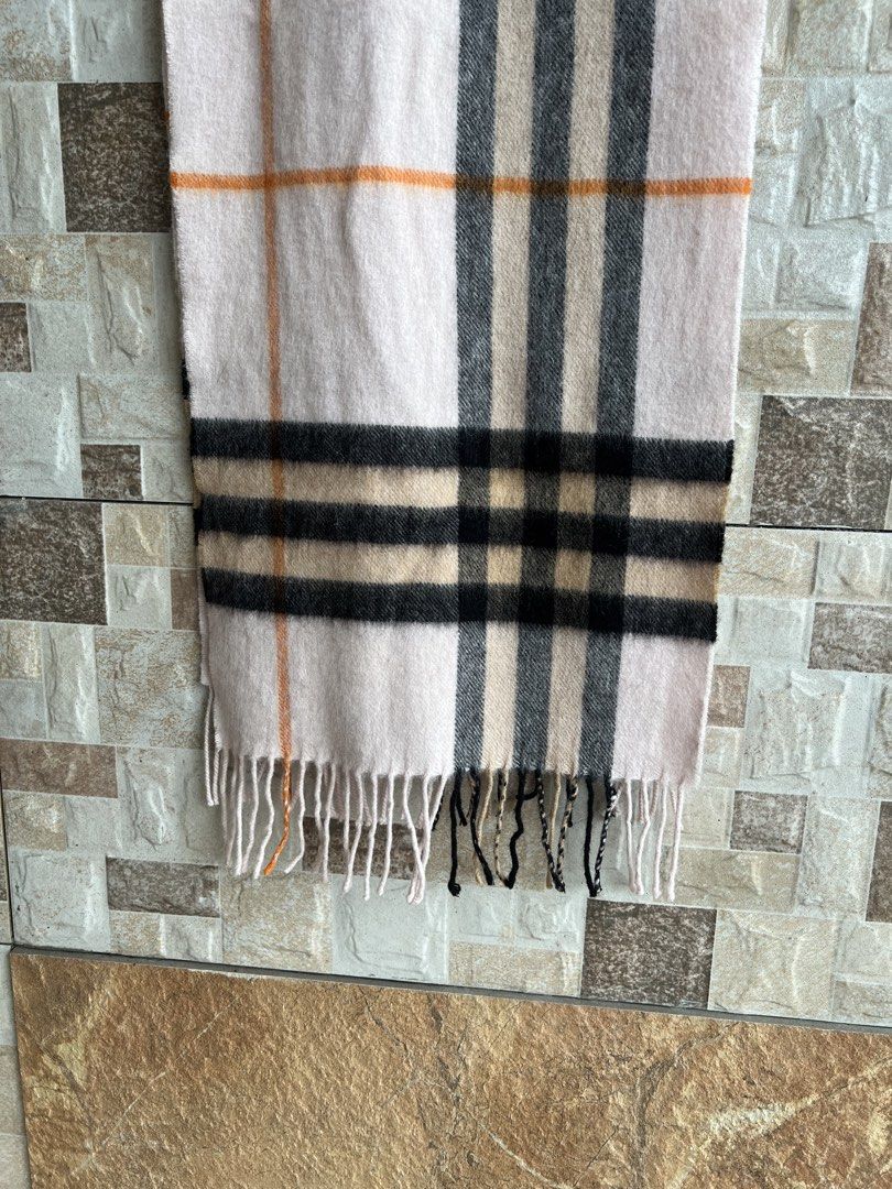 BURBERRY - PLAID DESIGN CASHMERE SCARF (Category: Scarves) located in Bacolod City. Submitted by timelessbyjosh (Listing ID 1470694109, Image 3). Description: BEST FOR COZY OUTFITS SIZE : ACTUAL COLOR : BLACK , BEIGE , BROWN & ORANGE COLOR RATE : 10 OUT OF 10 CONDITION : EXCELLENT MATERIAL : 100 % CASHMERE MADE IN : SCOTLAND FLAWS : NONE DIMENSIONS LENGTH - 65 WIDTH - 11. 5 MEASUREMENT TAKEN WHILE LAYING FLAT..