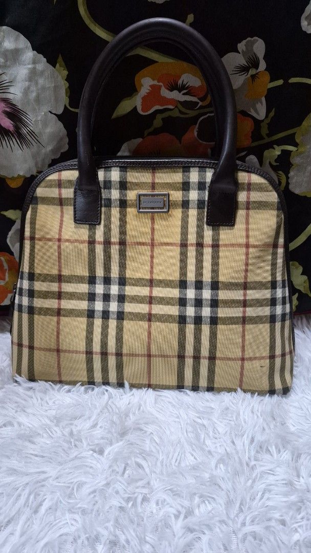 Burberry Check Nova Check Handbag Tote (Category: Looking For) located in Baguio. Submitted by jhaz_bags (Listing ID 1470678402, Image 2). Description: - Authentic Burberry handbag in iconic nova check canvas - Premium brown leather top handles and trim - Silver-tone hardware featuring front Burberry logo plate - Secure zip top closure - Clean interior with signature woven Burberry text pattern and zipped pocket - Excellent, well-maintained condi