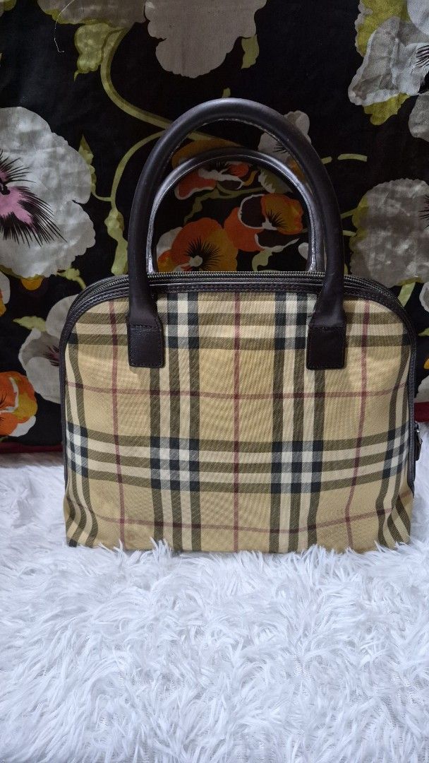 Burberry Check Nova Check Handbag Tote (Category: Looking For) located in Baguio. Submitted by jhaz_bags (Listing ID 1470678402, Image 1). Description: - Authentic Burberry handbag in iconic nova check canvas - Premium brown leather top handles and trim - Silver-tone hardware featuring front Burberry logo plate - Secure zip top closure - Clean interior with signature woven Burberry text pattern and zipped pocket - Excellent, well-maintained condi
