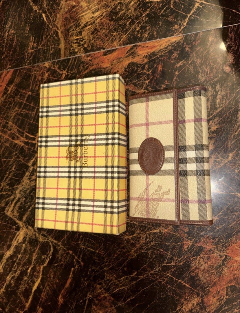 Preloved Burberry Vintage Wallet with Box (Category: Luxury Bags & Wallets) located in Las Pinas. Submitted by iamluna14 (Listing ID 1470716938, Image 1). Description: Authentic Vintage Burberrys Check Wallet with Original Box ✨ Rare collectible piece from the pre-1999 "Burberrys" era! This classic wallet features the iconic Haymarket check pattern with the shadow Equestrian Knight logo embedded in the canvas, beautifully finished with brown leat