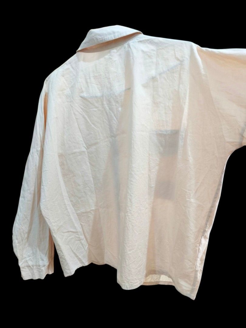 Button-Down Long Sleeve Shirt with Pockets (Category: Longsleeves) located in Taguig. Submitted by deyerreC2020 (Listing ID 1470608631, Image 3). Description: sale tops L-semi XL preloved nice pastel peach/apricot color tops in good stocked condition button-down shirt with drop shoulders and double chest pockets. Relaxed, oversized fit. Measures on photos . Button cuffs on sleeves. Small ink stain near one cuff( can wash though, shown in close-up