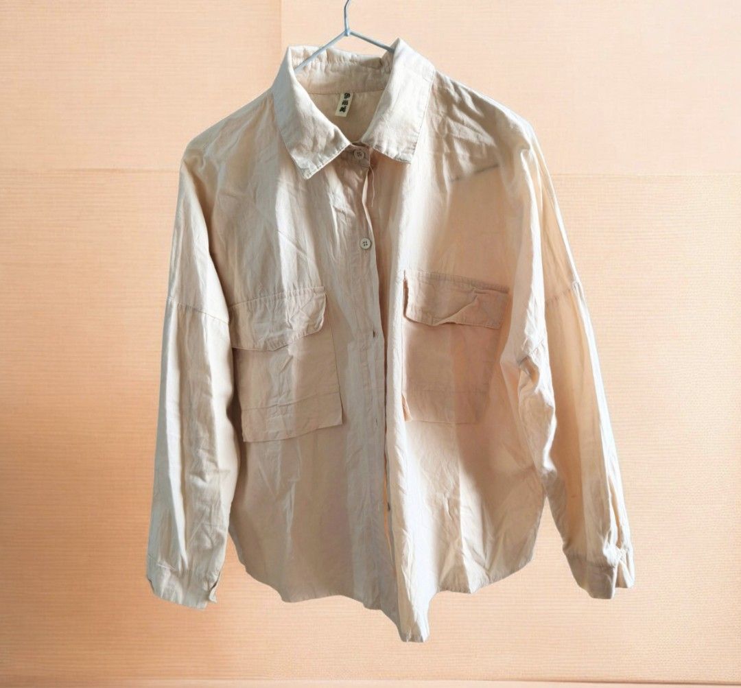 Button-Down Long Sleeve Shirt with Pockets (Category: Longsleeves) located in Taguig. Submitted by deyerreC2020 (Listing ID 1470608631, Image 1). Description: sale tops L-semi XL preloved nice pastel peach/apricot color tops in good stocked condition button-down shirt with drop shoulders and double chest pockets. Relaxed, oversized fit. Measures on photos . Button cuffs on sleeves. Small ink stain near one cuff( can wash though, shown in close-up