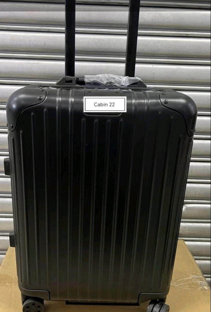 Cabin 22 Luggage Hard Shell Suitcase (Category: Luggage) located in Manila. Submitted by dh3nz1 (Listing ID 1470742041, Image 3). Description: - Size: Cabin 22 hard shell suitcase - Design: Modern vertical ribbed finish with a sleek metal tag plate - Mobility: 4 smooth-rolling spinner wheels and a telescoping handle - Comfort: Retractable top handle with protective plastic wrap - Colors: Available in silver, gold, and black - Durability: Sturdy b