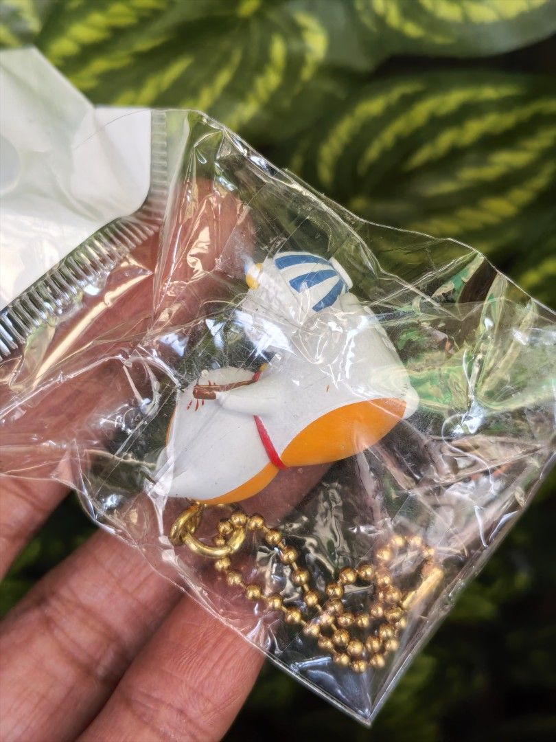 Calico cat holding shaved ice keychain charm (Category: Character Goods) located in Paranaque City. Submitted by furugiyafinds (Listing ID 1470619363, Image 3). Description: - Adorable calico cat keychain featuring a white body, orange and grey patches, and a cute red collar - Holds a refreshing bowl of blue-striped shaved ice - Equipped with a secure gold-toned ball chain - Brand new and still sealed in its original clear plastic packaging - Per