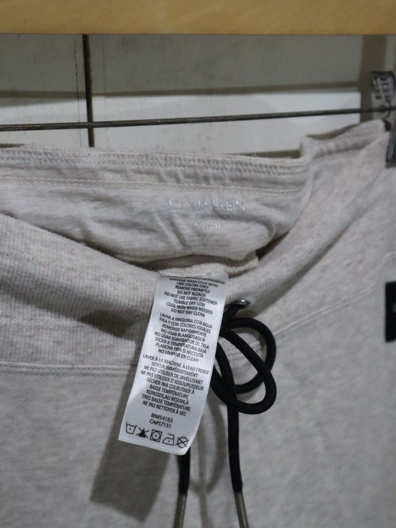 Calvin Klein Beige Neutral Jogger Pants (Category: Other Bottoms) located in Tarlac. Submitted by gatheredthrift (Listing ID 1470647779, Image 2). Description: condition: 9/10| has stain I see last photo mine — 349 + sf 》mod: direct JNT (min. 54) 》📍Tarlac.