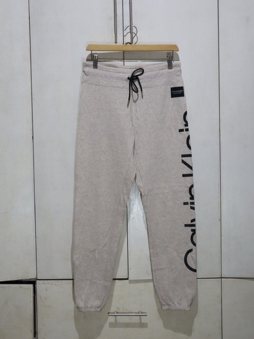 Calvin Klein Beige Neutral Jogger Pants (Category: Other Bottoms) located in Tarlac. Submitted by gatheredthrift (Listing ID 1470647779, Image 1). Description: condition: 9/10| has stain I see last photo mine — 349 + sf 》mod: direct JNT (min. 54) 》📍Tarlac.