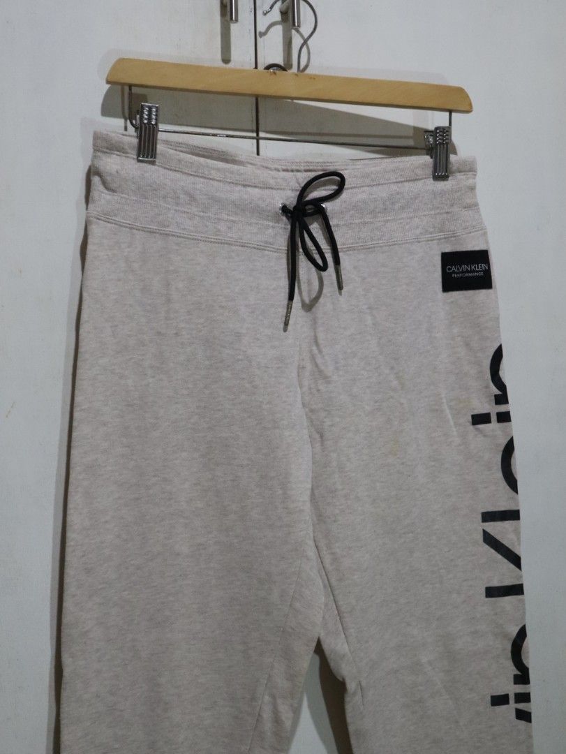 Calvin Klein Beige Neutral Jogger Pants (Category: Other Bottoms) located in Tarlac. Submitted by gatheredthrift (Listing ID 1470647779, Image 3). Description: condition: 9/10| has stain I see last photo mine — 349 + sf 》mod: direct JNT (min. 54) 》📍Tarlac.