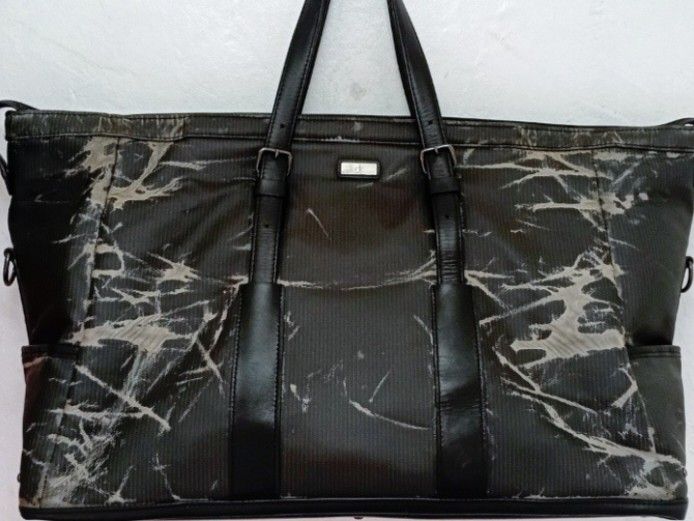 Calvin Klein ck Travel Weekender Bag (Category: Sling Bags) located in Navotas City. Submitted by ms.soulana (Listing ID 1470628713, Image 2). Description: PreOwned LikeNew lightly Used Authentic Vintage Calvin Klein X IKETEI japan Mens Weekender bag Large -XL - Type: Travel Duffle Bag / Weekender - Color/Design: Black with distressed white crackle print - Details: Dark leather straps with buckle accents, metal CK logo badge, and side pockets - C