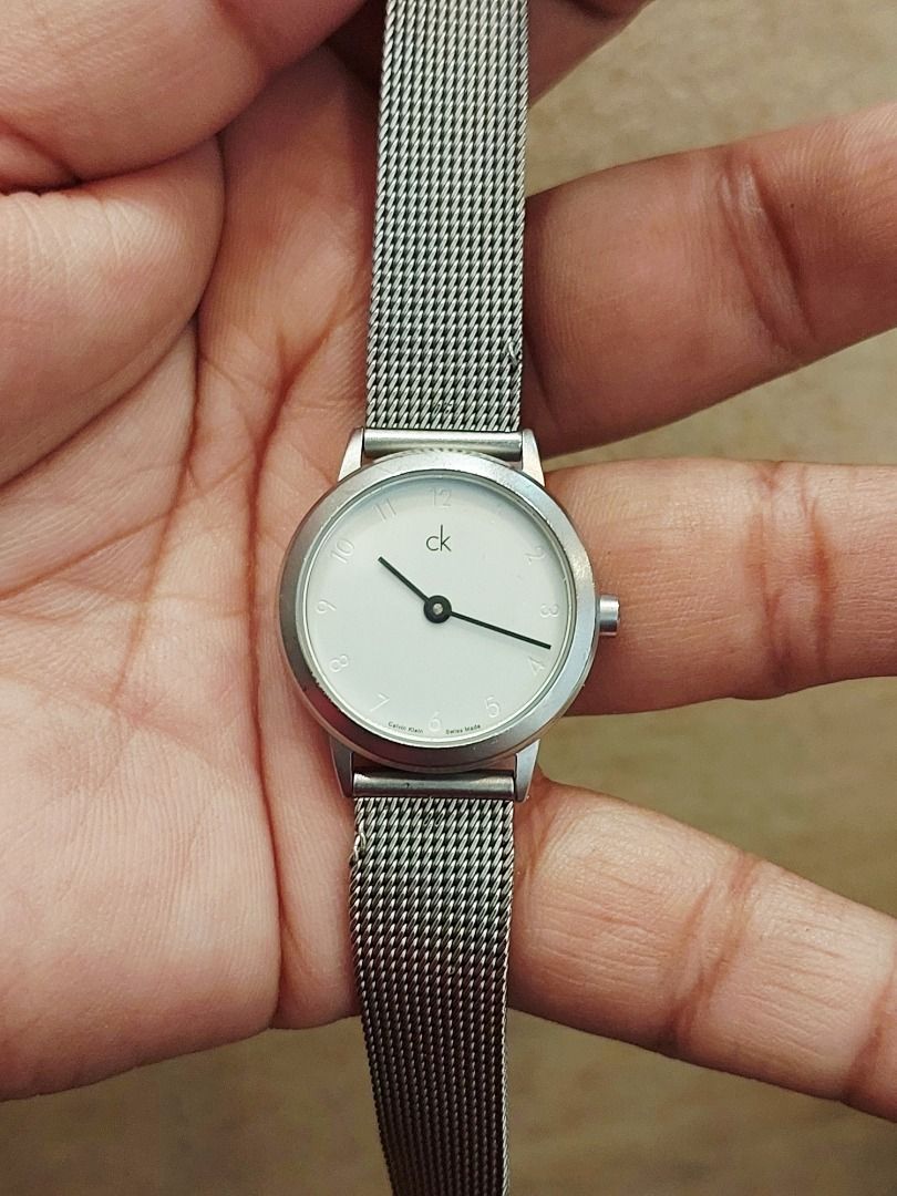 Calvin Klein K03131 Mesh Strap Watch (Category: Women's Watches) located in Batangas. Submitted by vintageanddainty (Listing ID 1470590331, Image 1). Description: - Brand: Calvin Klein - Model: K03131 (engraved on case back) - Movement: Swiss Made - Dial: Round white dial with black hands and numeric hour markers - Strap: Silver stainless steel mesh with secure clasp closure - Water Resistance: Up to 30M - Style: Clean minimalist design, standard