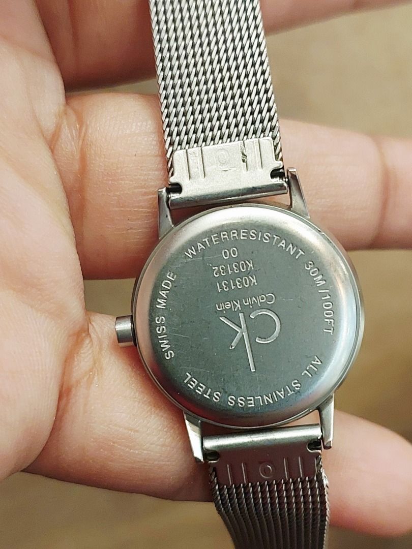 Calvin Klein K03131 Mesh Strap Watch (Category: Women's Watches) located in Batangas. Submitted by vintageanddainty (Listing ID 1470590331, Image 3). Description: - Brand: Calvin Klein - Model: K03131 (engraved on case back) - Movement: Swiss Made - Dial: Round white dial with black hands and numeric hour markers - Strap: Silver stainless steel mesh with secure clasp closure - Water Resistance: Up to 30M - Style: Clean minimalist design, standard