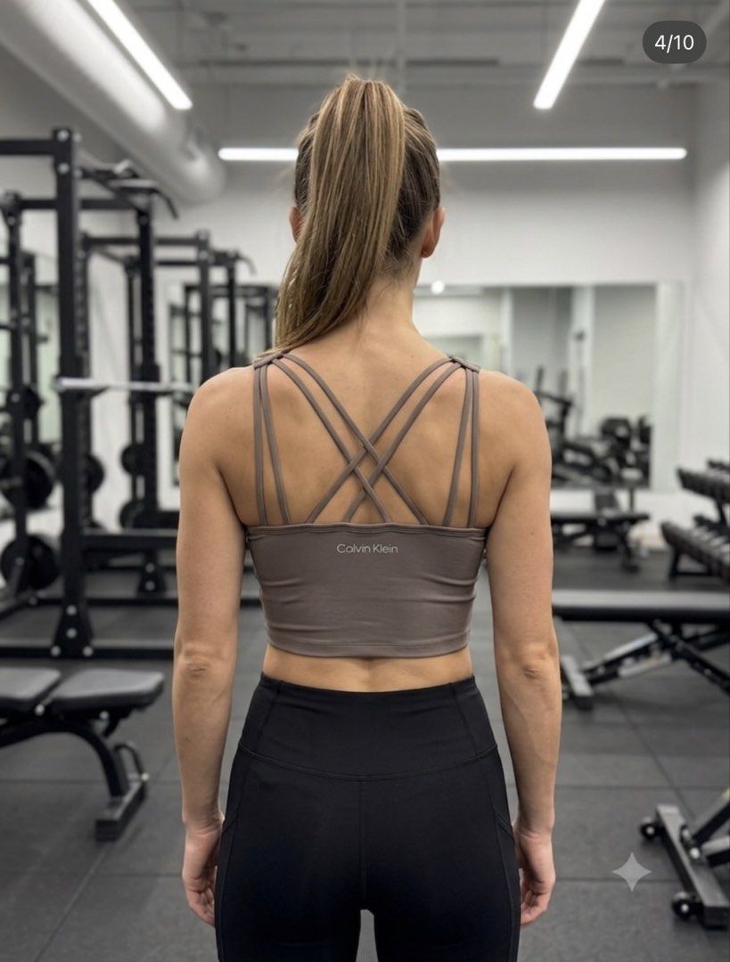Calvin Klein Performance Strappy Back Crop Top Grey (Category: Activewear) located in Manila. Submitted by ayoltomagotchi (Listing ID 1470662066, Image 3). Description: - Brand: Calvin Klein Performance - Item: Athletic crop top - Color: Grey with subtle white logo on back band - Design: V-neck front with stylish strappy cross-back - Material: Soft stretch fabric for maximum comfort - Condition: Brand new with tags (BNWT) - Ideal for: Gym workout