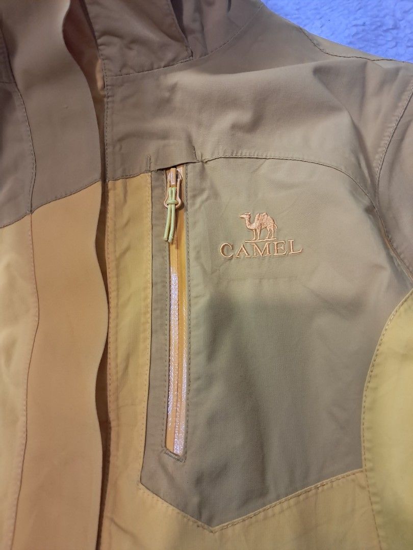 Camel outdoor rain jacket (Category: Coats, Jackets and Outerwear) located in Baguio. Submitted by mishmashfritz (Listing ID 1470666529, Image 2). Description: excellent used condition, thrifted, needs wash, light stain sa sleeves, waterproof, breathable jacket, adjustable hood.