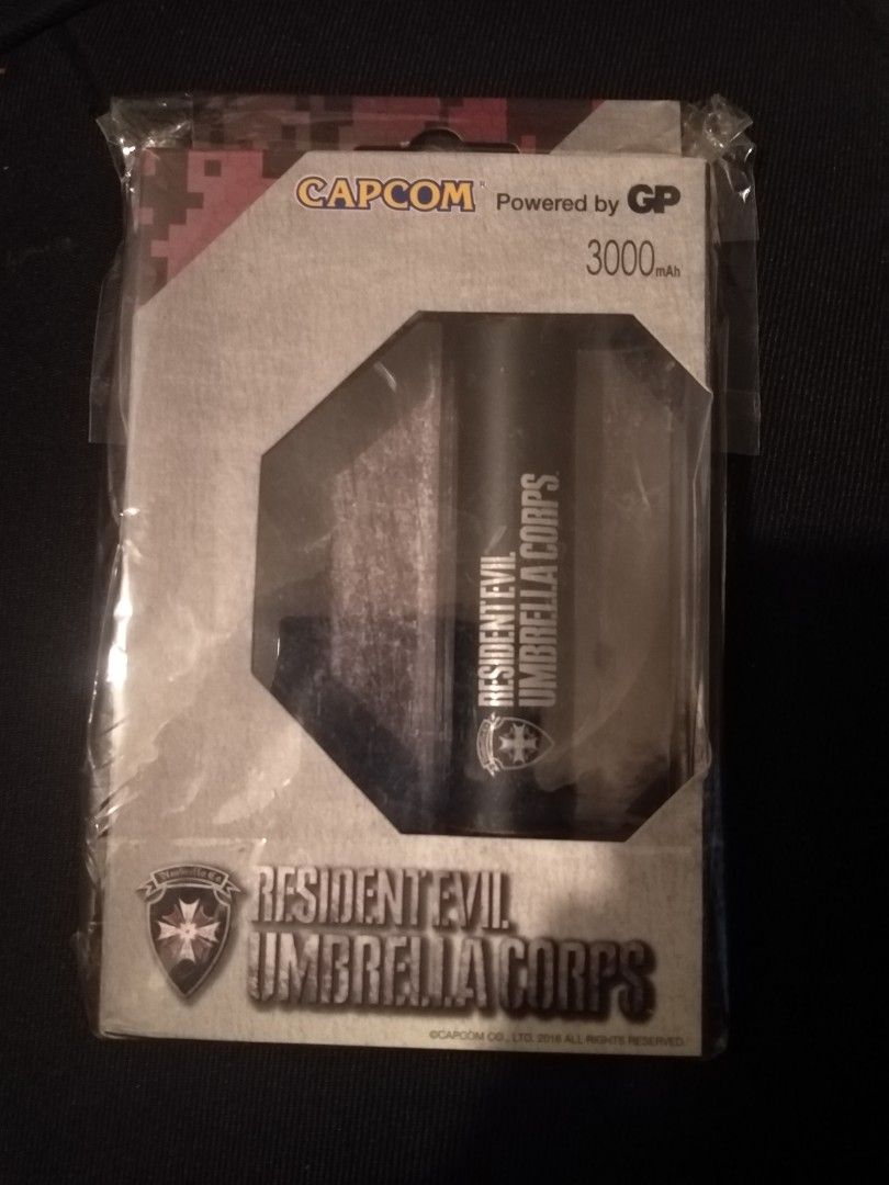 Capcom Resident Evil Umbrella Corps 3000mAh Power Bank (Category: Batteries & Power Banks) located in Cavite. Submitted by emilgarcia09 (Listing ID 1470615604, Image 1). Description: - Authentic Capcom Resident Evil Umbrella Corps merchandise still in original packaging - Reliable 3000mAh capacity powered by GP - Sleek and durable matt aluminum casing - Smart LED power indication - Built-in over-temperature, short circuit, and over-charging prote