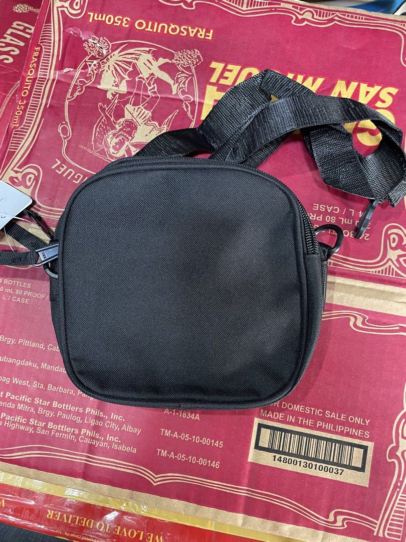Carharrt WIP Black Parcel Crossbody Bag (Category: Sling Bags) located in Baguio. Submitted by elayor3 (Listing ID 1470701099, Image 3). Description: - Brand: Carhartt WIP - Color: Black - Condition: Brand new with tags - Material: Durable heavy-duty canvas - Hardware: YKK zippers with branded pull tabs - Compartments: Multiple zipped pockets and front flap pocket with iconic logo patch - Versatility: Adjustable strap for shoulder or crossbody we