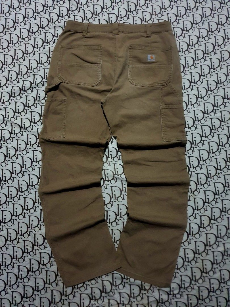 Carhartt Carpenter pants (Category: Chinos) located in San Fernando. Submitted by retro.district. (Listing ID 1470722377, Image 1). Description: - Carhartt Carpenter pants - Size: Waistline: 34 Length: 40 Thighs: 12 Leg opening: 8.5 - Condition: Excellent - No issue - Color Rate: 9.5/10.