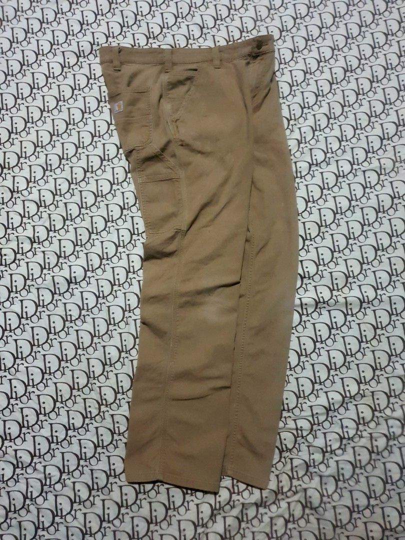 Carhartt Carpenter pants (Category: Chinos) located in San Fernando. Submitted by retro.district. (Listing ID 1470722377, Image 3). Description: - Carhartt Carpenter pants - Size: Waistline: 34 Length: 40 Thighs: 12 Leg opening: 8.5 - Condition: Excellent - No issue - Color Rate: 9.5/10.