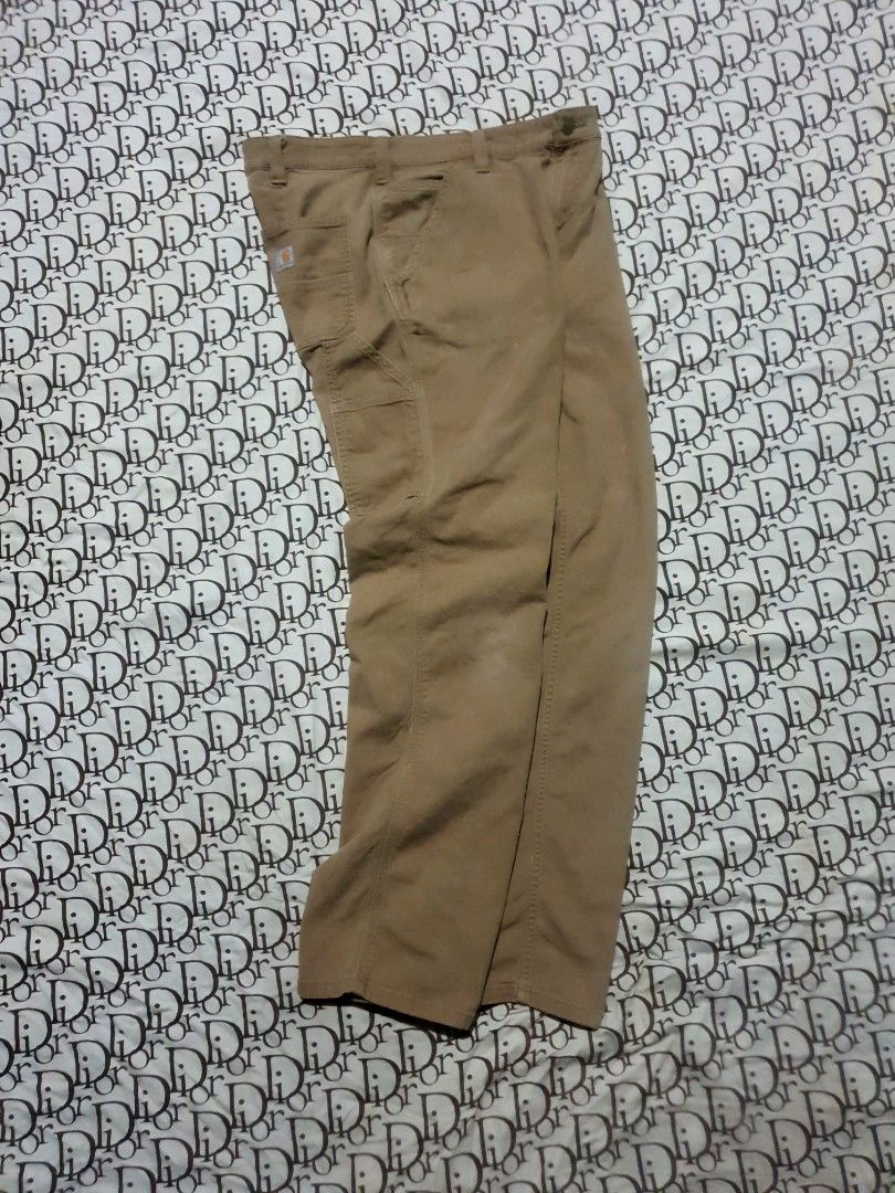 Carhartt Carpenter pants (Category: Chinos) located in San Fernando. Submitted by retro.district. (Listing ID 1470722377, Image 2). Description: - Carhartt Carpenter pants - Size: Waistline: 34 Length: 40 Thighs: 12 Leg opening: 8.5 - Condition: Excellent - No issue - Color Rate: 9.5/10.