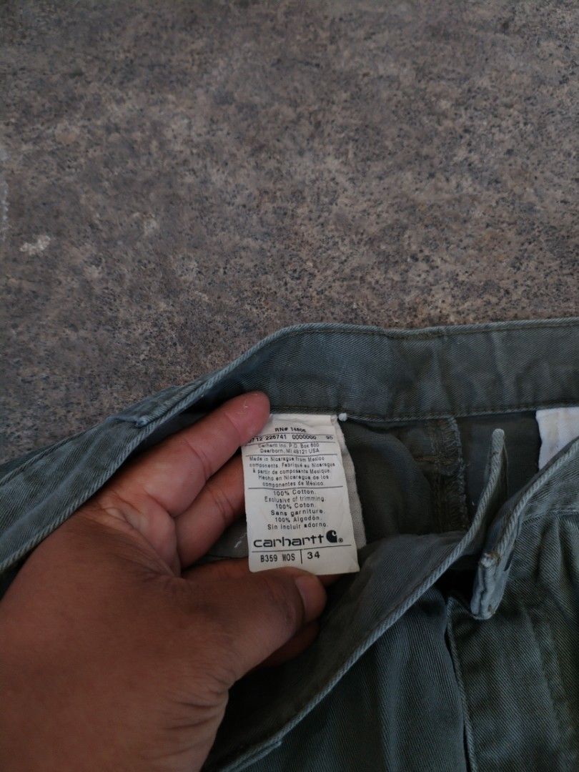 Carhartt Moss Green Work Shorts Size 34 (Category: Shorts) located in Legazpi City. Submitted by justinbarcelon (Listing ID 1470683745, Image 2). Description: - Brand: Carhartt - Item: Utility Shorts - Color: Moss Green - Size: Tagged 34 - Material: 100% cotton canvas - Closure: Button waist with zip fly - Features: Belt loops, back welt pockets with button closures and logo patch - Condition: Authentic workwear character with paint splatters and