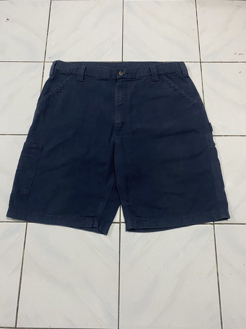 Carhartt Work Cargo Shorts Navy Blue (Category: Shorts) located in Cavite. Submitted by findsmore (Listing ID 1470742548, Image 1). Description: - Brand/Style: Carhartt classic carpenter work shorts - Color: Navy blue - Material: Rugged, durable canvas fabric - Features: Multiple utility pockets and hammer loop - Closure: Sturdy button closure with belt loops - Condition: Clean overall with no major flaws - Versatility: Great for everyday casual 