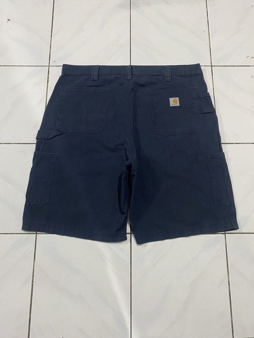 Carhartt Work Cargo Shorts Navy Blue (Category: Shorts) located in Cavite. Submitted by findsmore (Listing ID 1470742548, Image 2). Description: - Brand/Style: Carhartt classic carpenter work shorts - Color: Navy blue - Material: Rugged, durable canvas fabric - Features: Multiple utility pockets and hammer loop - Closure: Sturdy button closure with belt loops - Condition: Clean overall with no major flaws - Versatility: Great for everyday casual 