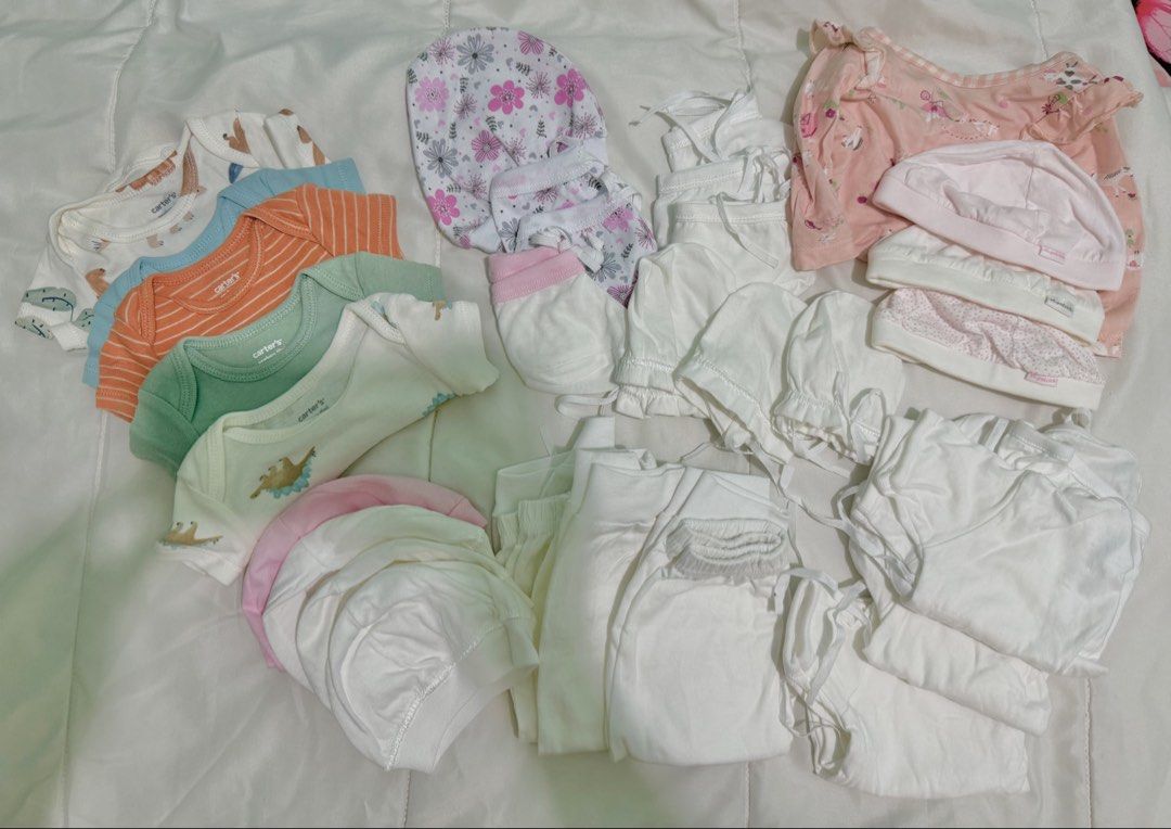 Carter's Newborn Baby Clothes Hats SET BUNDLE (Category: Babies & Kids Fashion) located in Manila. Submitted by closetbycony (Listing ID 1470574731, Image 1). Description: - Newborn baby clothing and accessories bundle, get everything for 1,000 pesos :) - Includes 5 pcs Carter's short sleeve bodysuits (white, blue, orange striped, green) - 1 Pink printed onesie with matching gingham bib - Accessories: 3 St. Patrick caps, 1 floral cap with scratch