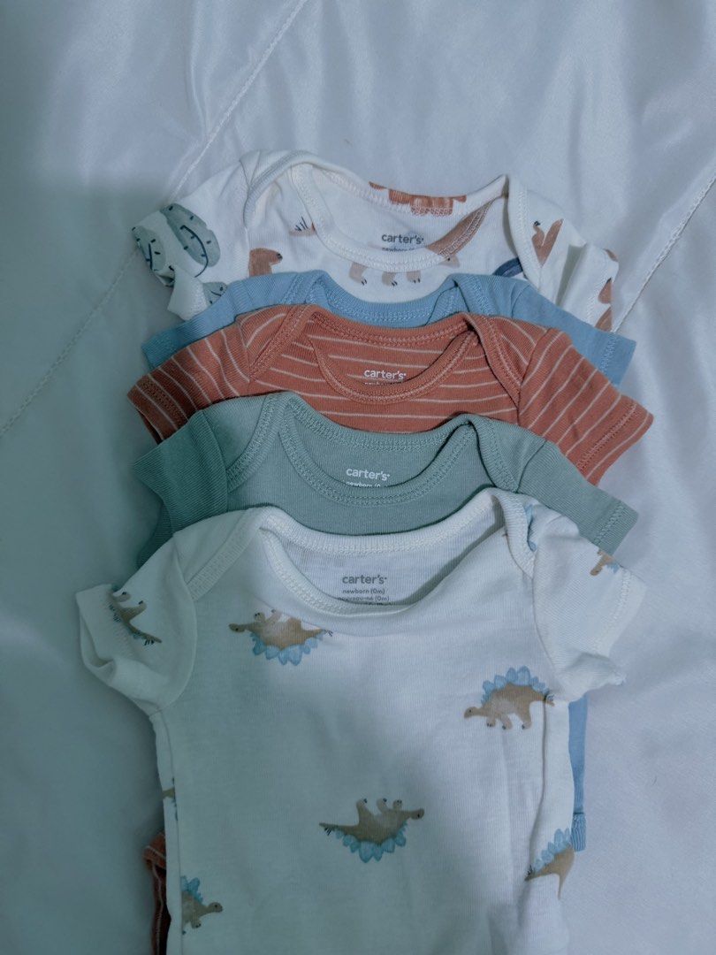Carter's Newborn Baby Clothes Hats SET BUNDLE (Category: Babies & Kids Fashion) located in Manila. Submitted by closetbycony (Listing ID 1470574731, Image 3). Description: - Newborn baby clothing and accessories bundle, get everything for 1,000 pesos :) - Includes 5 pcs Carter's short sleeve bodysuits (white, blue, orange striped, green) - 1 Pink printed onesie with matching gingham bib - Accessories: 3 St. Patrick caps, 1 floral cap with scratch