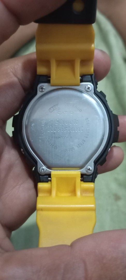 Casio G-Shock DW-6900 Fox Fire Yellow Black (Category: Men's Watches) located in Manila. Submitted by jhonevanma58082 (Listing ID 1470740874, Image 2). Description: - Model: Casio G-Shock DW-6900 Fox Fire digital watch - Colorway: Striking yellow and black design - Design: Unique spider web and skull graphics with strap text "G-SHOCK is dedicated to the soul foot in motion" - Display: Classic digital face equipped with EL backlight - Backplate: D