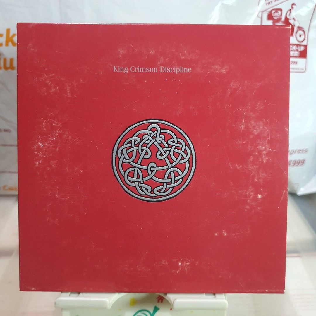 [CD] King Crimson Discipline Album (Category: CDs & DVDs) located in Quezon City. Submitted by collectionneursonline88 (Listing ID 1470572886, Image 1). Description: - Artist/Album: King Crimson - Discipline - Genre: Classic Rock - Key Tracks: Elephant Talk, Matte Kudasai, Frame by Frame, Indiscipline - Packaging: Red gatefold cover with band members photo inside and printed track list - Condition: Exterior shows some surface wear and minor scuff