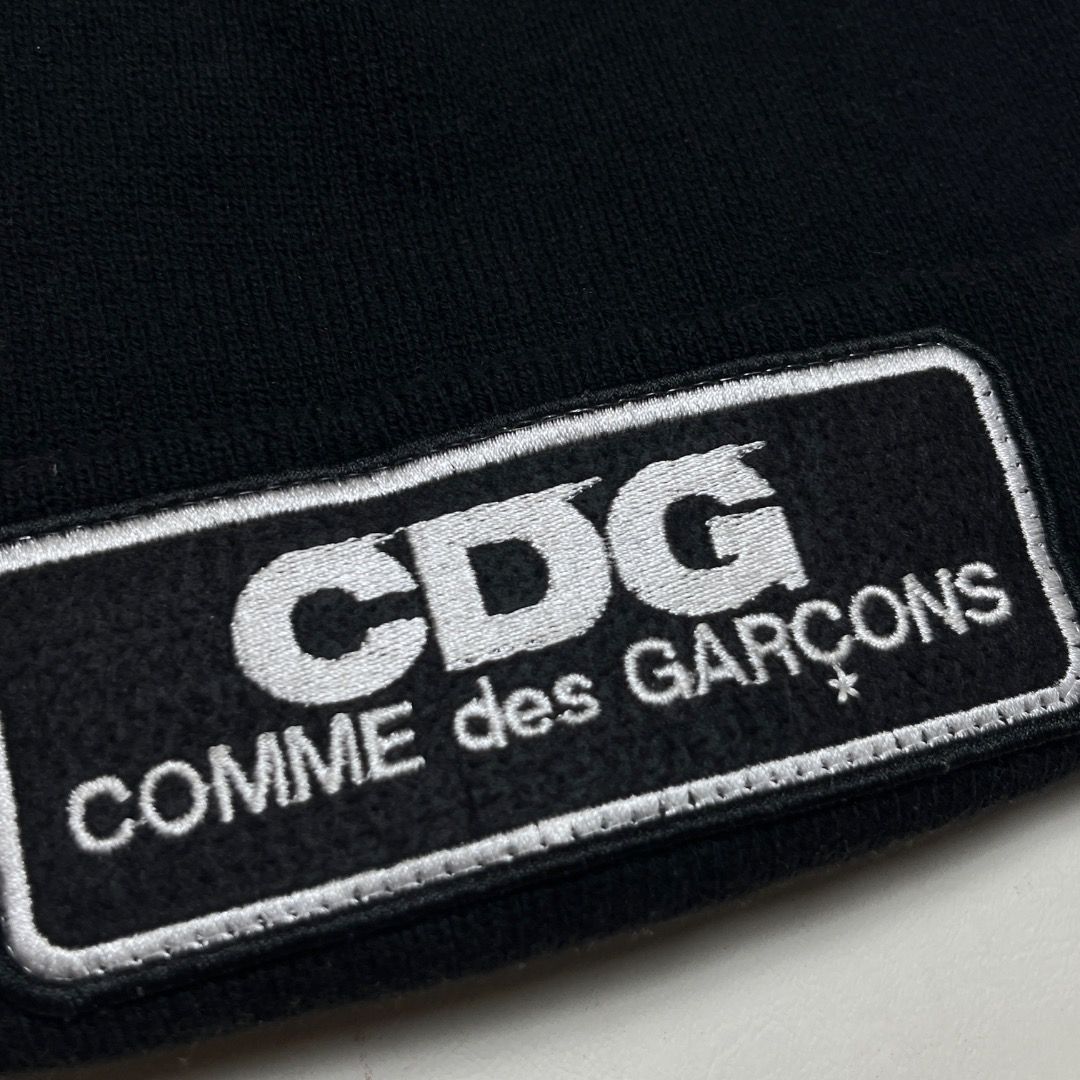 CDG COMME des GARÇONS Beanie (Category: Caps & Hats) located in Caloocan City. Submitted by achilles_grails (Listing ID 1470565865, Image 2). Description: - Brand: GOOD DESIGN SHOP COMME des GARÇONS - Color: Classic Black - Details: Embroidered white CDG & full brand lettering patch on the front - Material: Comfortable ribbed knit throughout - Sizing: Standard adult size - Condition/Details: Includes interior care tags and product code IS-K602.