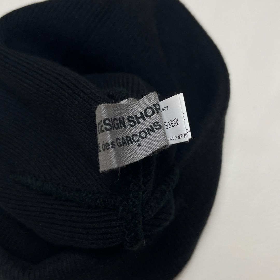 CDG COMME des GARÇONS Beanie (Category: Caps & Hats) located in Caloocan City. Submitted by achilles_grails (Listing ID 1470565865, Image 3). Description: - Brand: GOOD DESIGN SHOP COMME des GARÇONS - Color: Classic Black - Details: Embroidered white CDG & full brand lettering patch on the front - Material: Comfortable ribbed knit throughout - Sizing: Standard adult size - Condition/Details: Includes interior care tags and product code IS-K602.