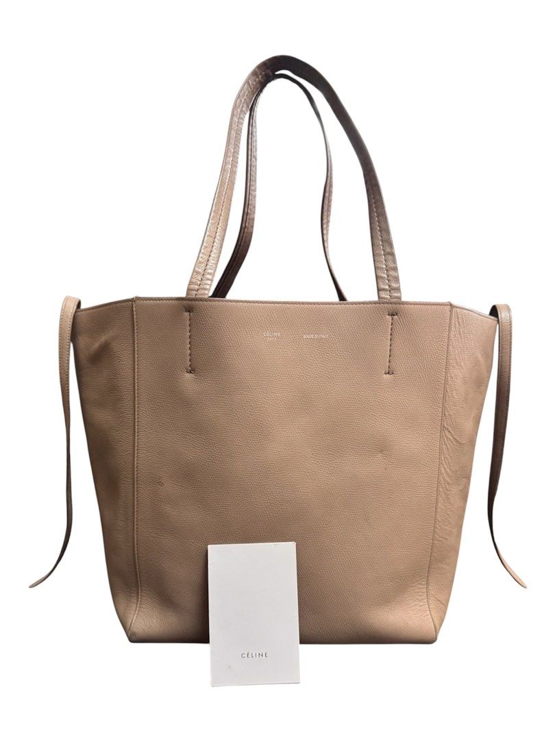 Celine Cabas Phantom Tote Bag (Category: Tote Bags) located in Baguio. Submitted by pwz-eshop (Listing ID 1470639028, Image 1). Description: • Up for Grabs!! • Guaranteed Authentic!! • Flaws: Heavy signs of use on handles, rubs on base corners, scuffs on lining, tiny cracks on lips edging, minor stains and press marks on leather. (please see photos) • BRAND: CELINE. • DIMENSIONS: length 19", height 12", width 6.5", handle drop: 9". • SERIAL NUMBE